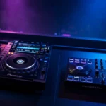 Club CDJ players and mixer next to an all-in-one DJ controller compared