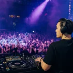 DJ performing to a packed crowd, representing a thriving DJ career