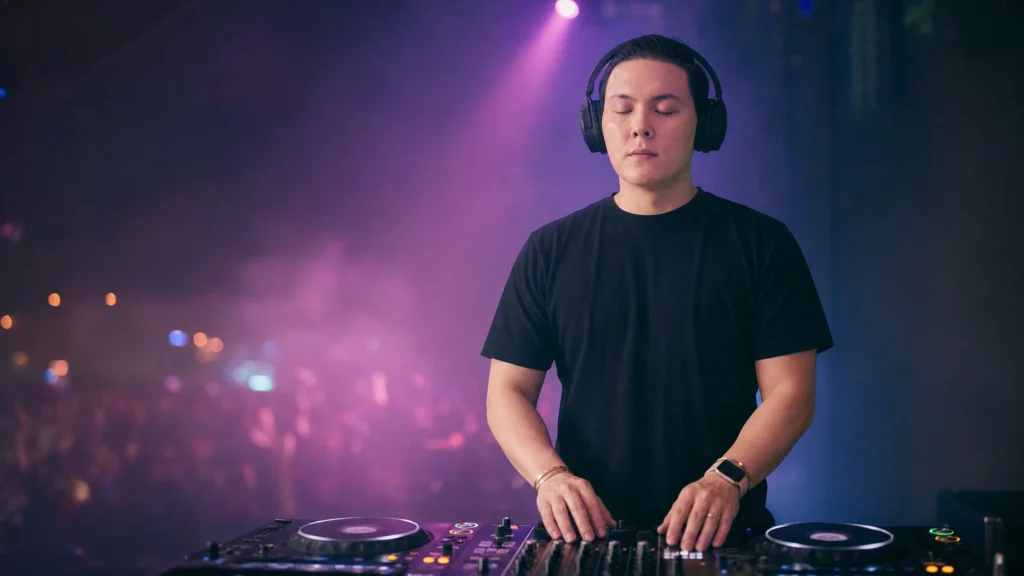 DJ taking a calming breath behind the decks before performing