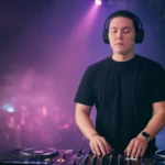 DJ taking a calming breath behind the decks before performing
