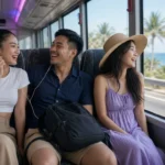 Young Thai travellers laughing on an air-conditioned coach heading to the coast